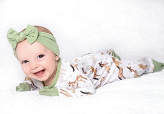 Baby girl wearing bamboo pajamas for toddlers and kids in Perfect Ponies print